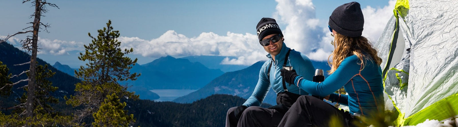 Man and woman wearing base layers on a mountain