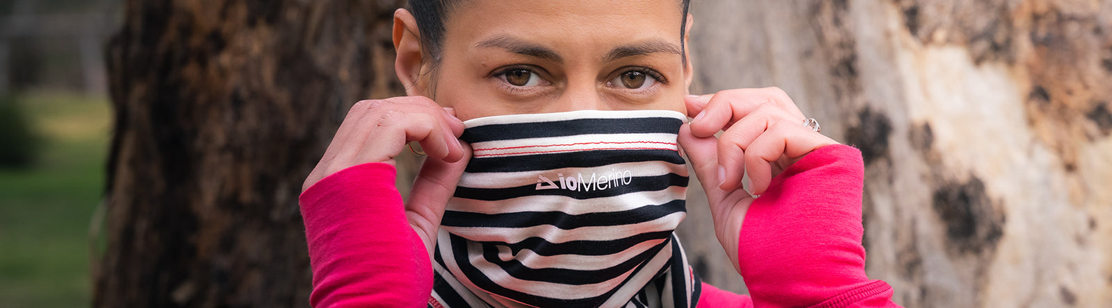 Woman wearing neck tube as a face mask