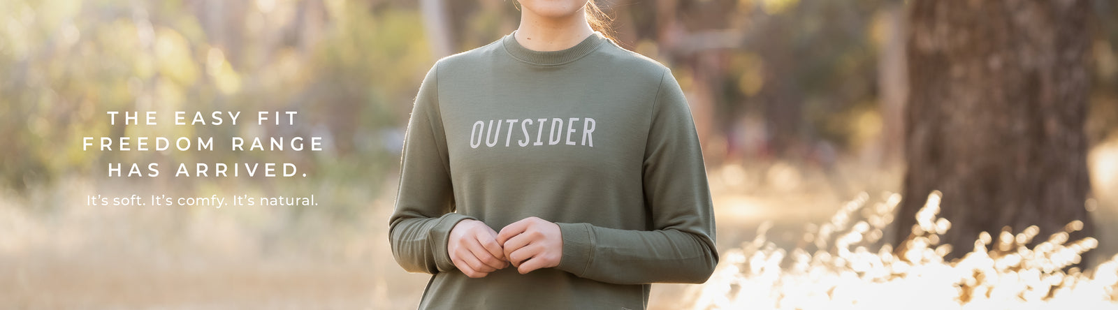 Woman wearing sweatshirt, image taken outdoors